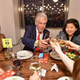 Chef Anthony Bourdain (center) dines with guests at the (RED) Supper hosted by Mario Batali with Anthony Bourdain on June 2, 2016, in New York City.